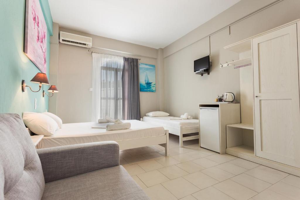Postel nebo postele na pokoji v ubytování Protopapas Rooms