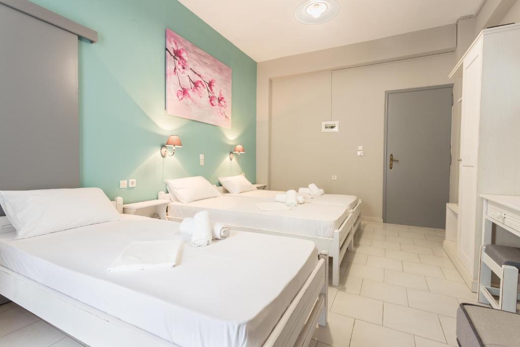 Postel nebo postele na pokoji v ubytování Protopapas Rooms