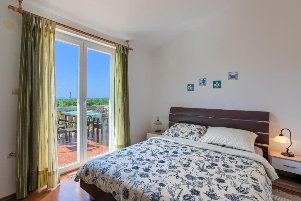 Posteľ alebo postele v izbe v ubytovaní Apartment Monica