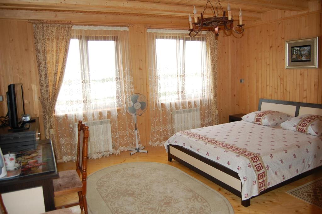 Postel nebo postele na pokoji v ubytování U Olgi