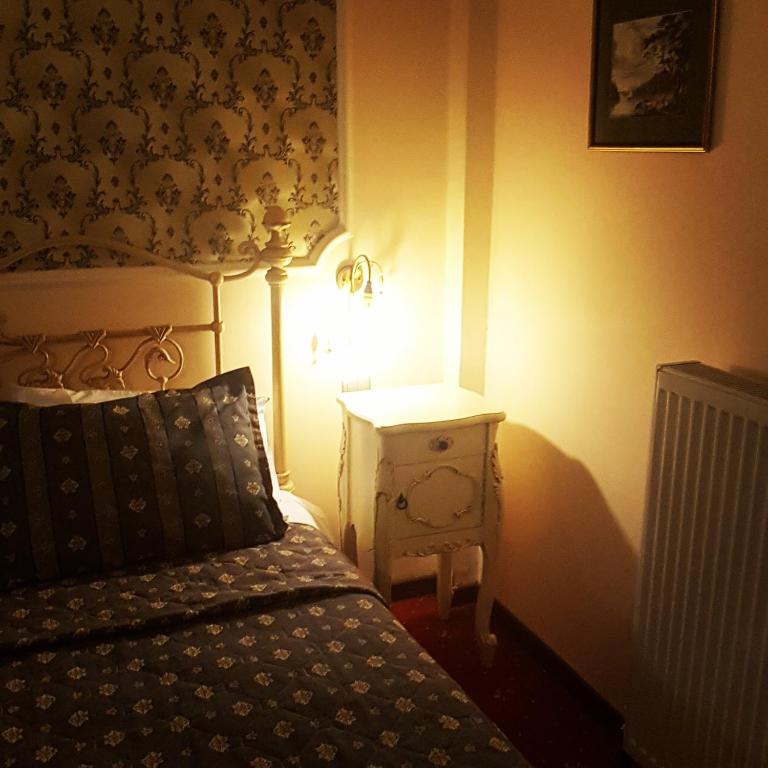 Postel nebo postele na pokoji v ubytování Hotel Mirto