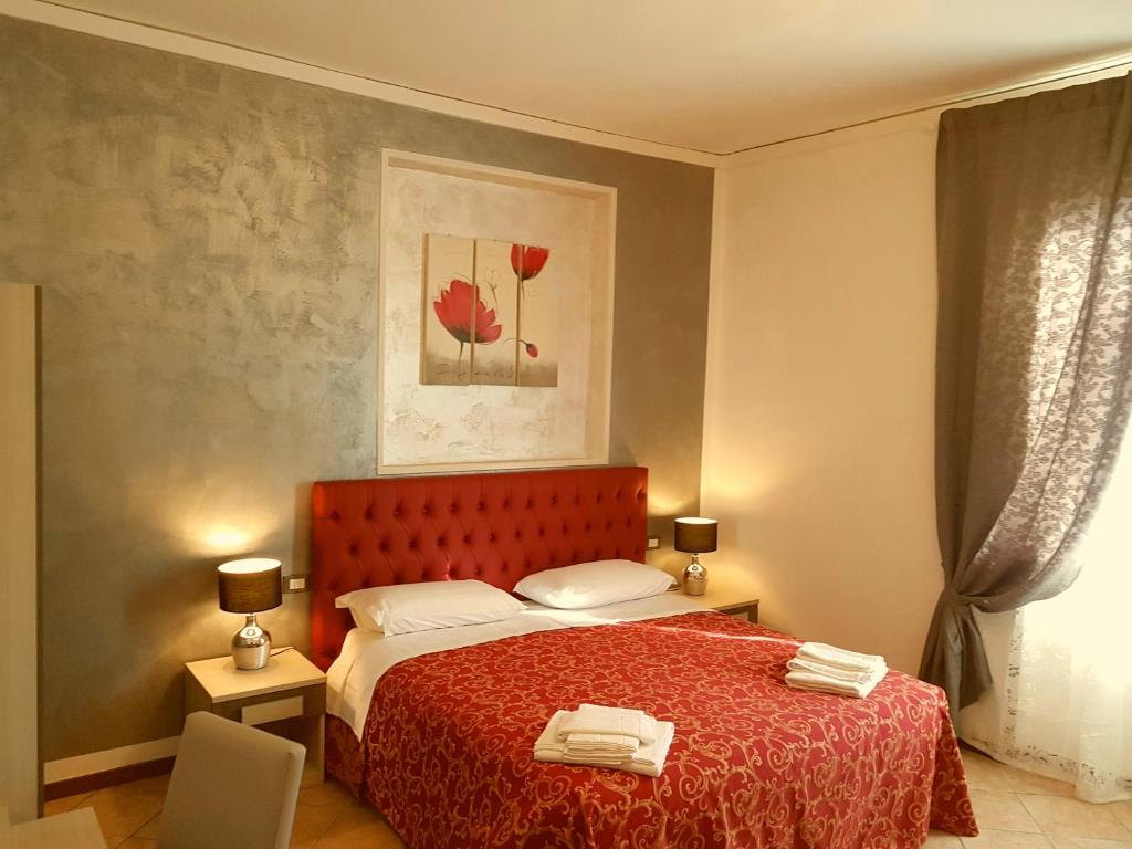 A bed or beds in a room at B&B La Cittadella