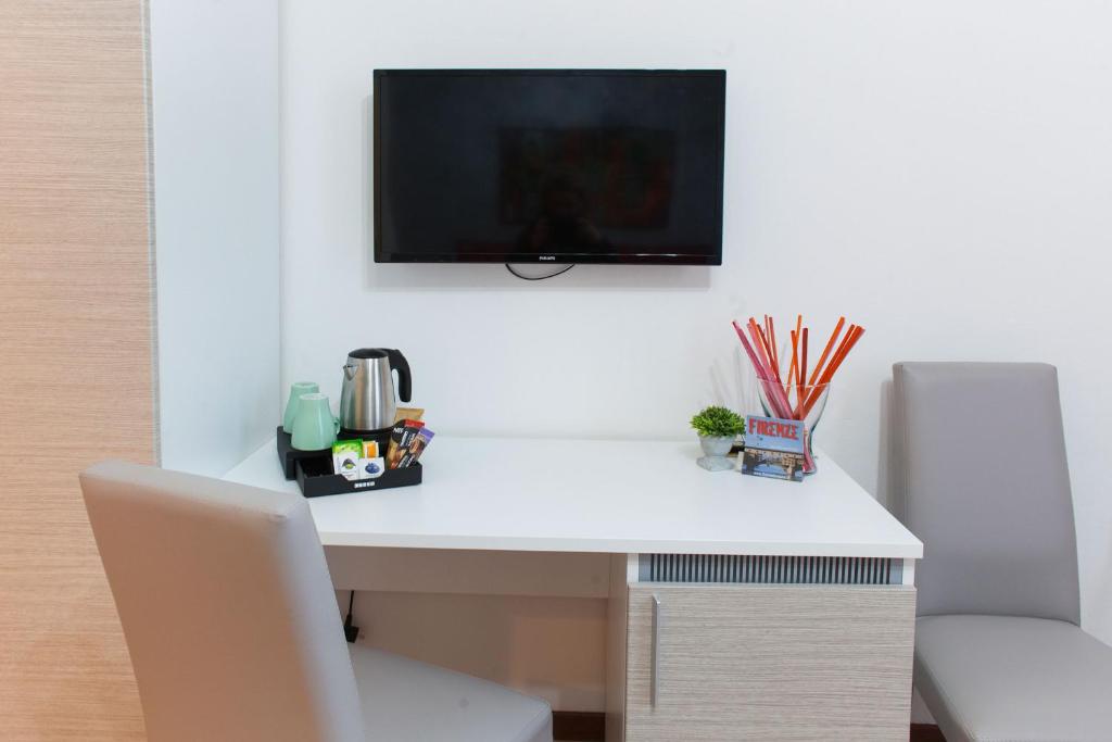 A television and/or entertainment centre at B&B La Cittadella