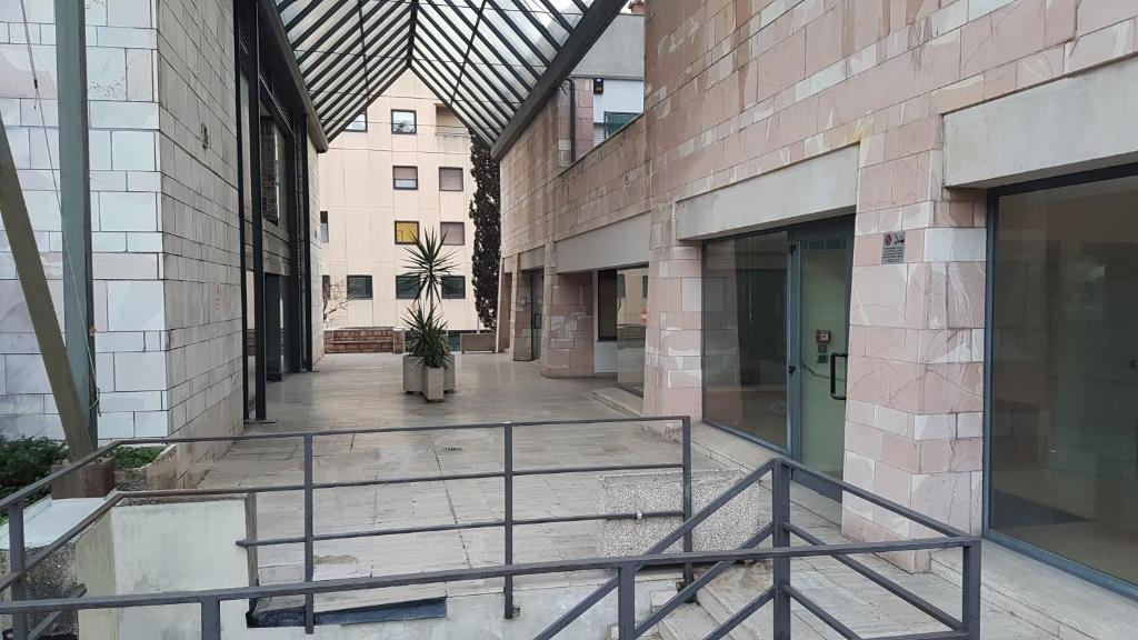 a hallway of a building with a staircase in it at Casa Nadia in Perugia