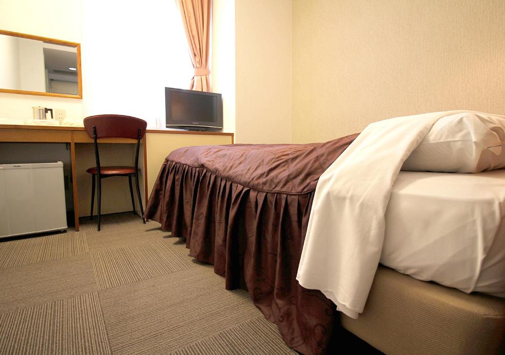 Postel nebo postele na pokoji v ubytování Hotel Trend Funabashi