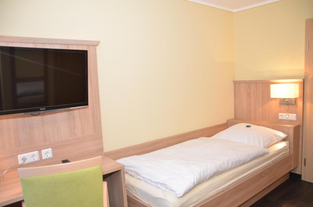 Postel nebo postele na pokoji v ubytování Hotel Sassor
