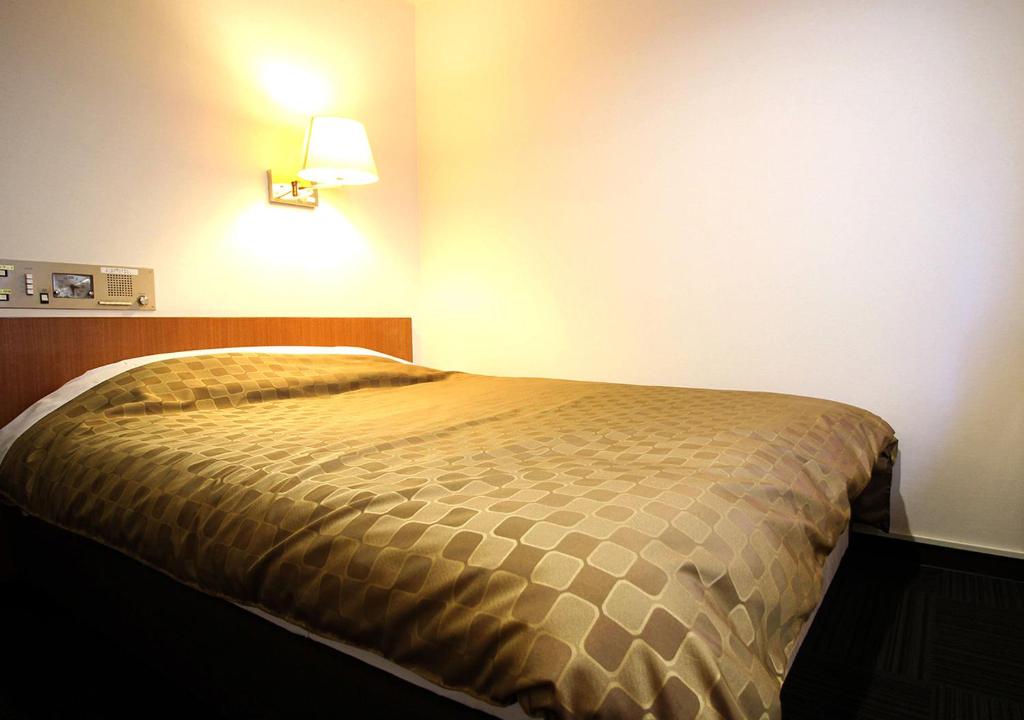 Postel nebo postele na pokoji v ubytování Hotel Trend Funabashi