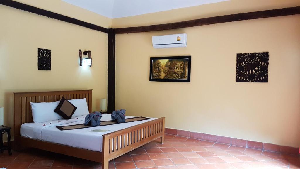 Postel nebo postele na pokoji v ubytování Mealea Resort