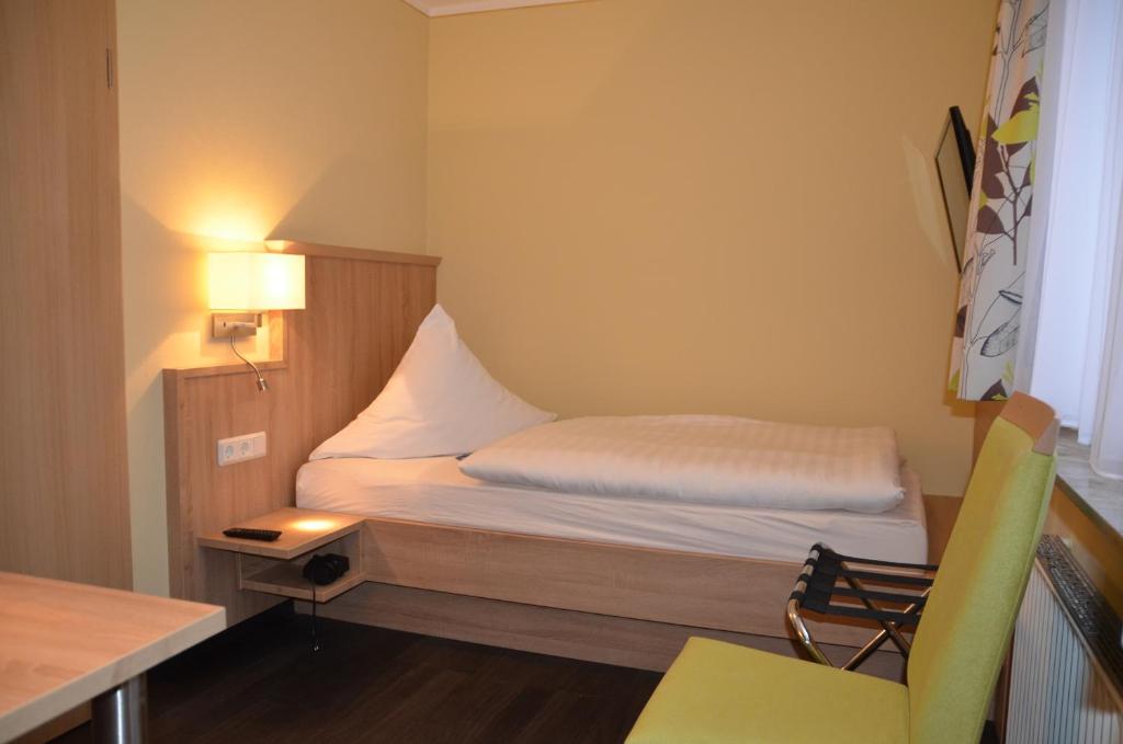 Postel nebo postele na pokoji v ubytování Hotel Sassor