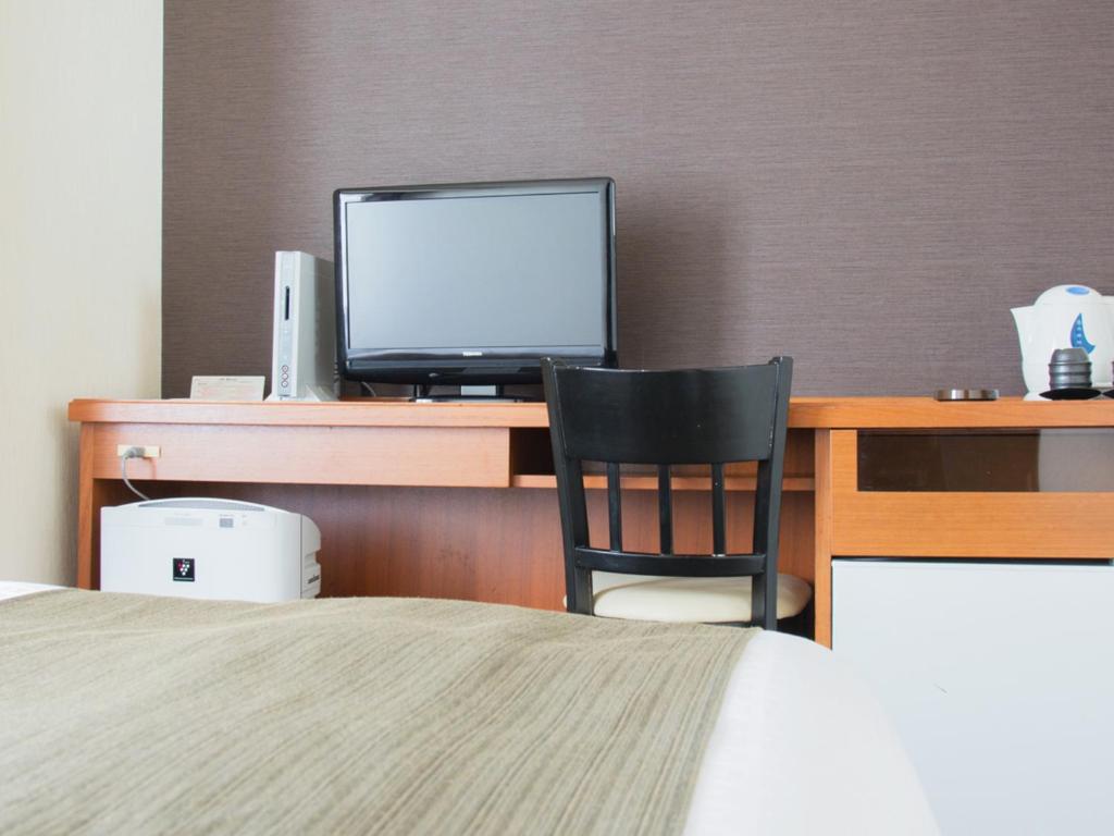 Postel nebo postele na pokoji v ubytování Hotel Abest Nagano Ekimae