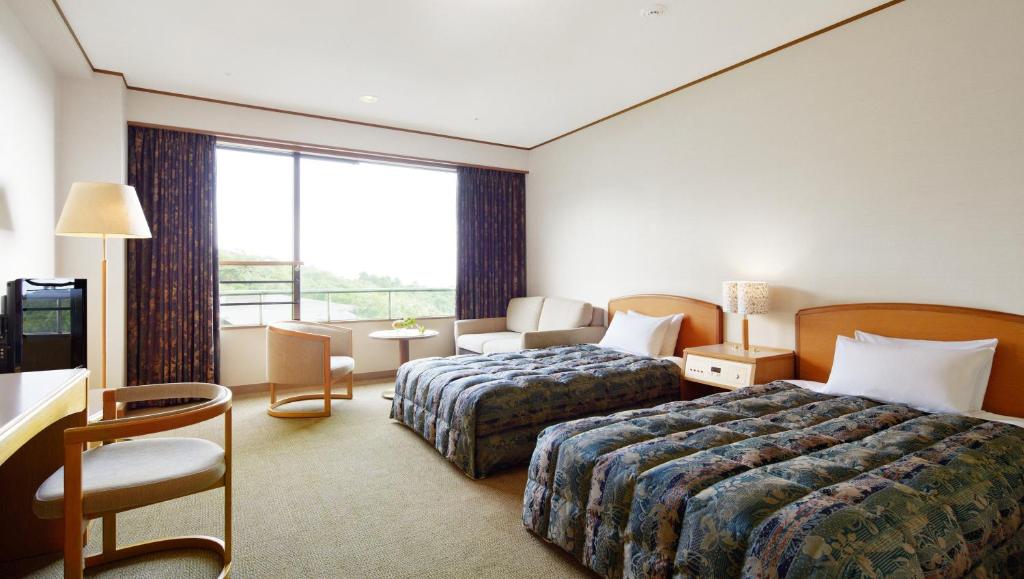Postel nebo postele na pokoji v ubytování Hotel Laforet Nasu