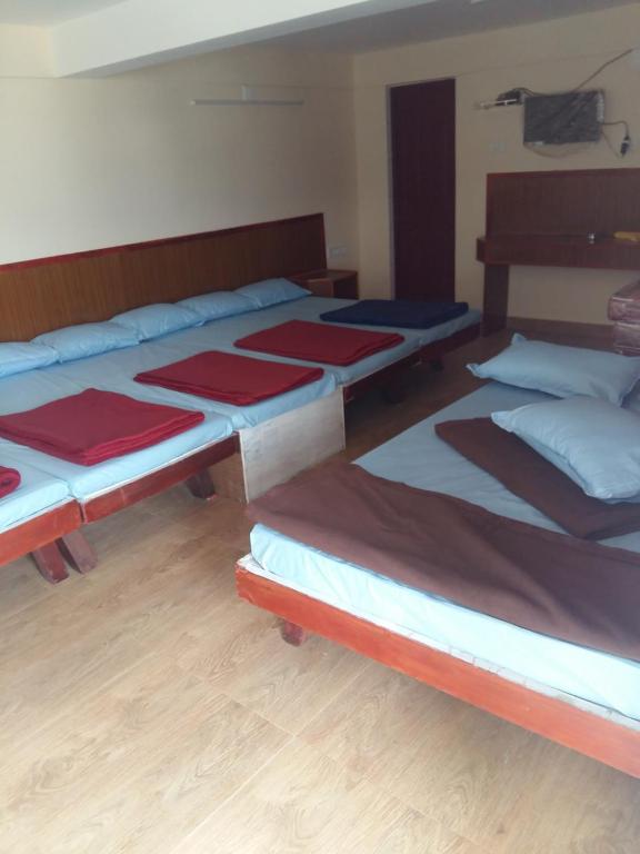 Postel nebo postele na pokoji v ubytování Nook Residency