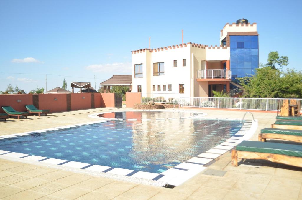 The swimming pool at or close to Regency Mount Kenya Hotel