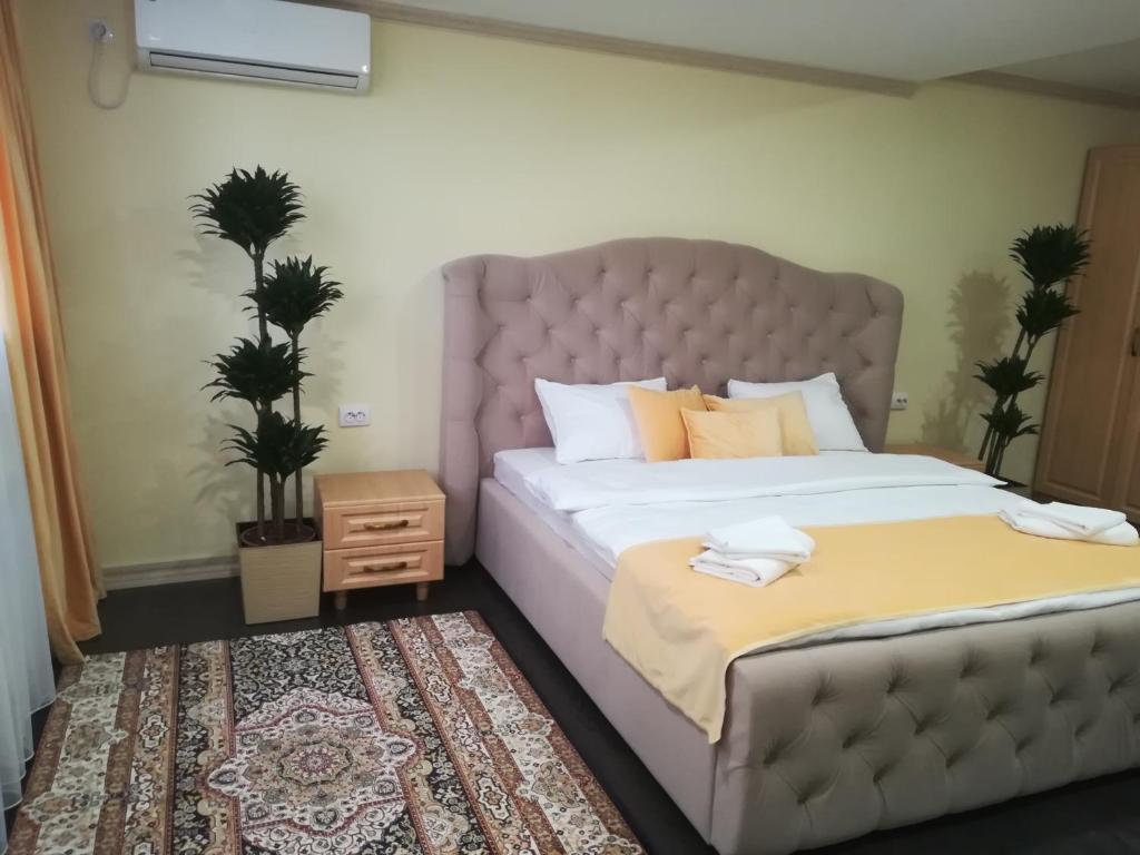 Postel nebo postele na pokoji v ubytování Jasmine Hotel