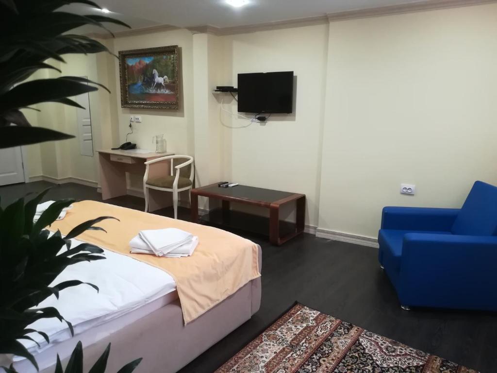 TV a/nebo společenská místnost v ubytování Jasmine Hotel