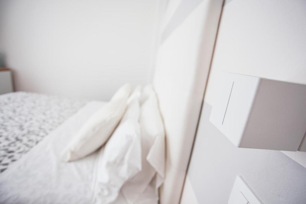 Postel nebo postele na pokoji v ubytování Hotel Geminus B&B
