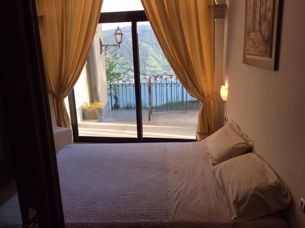 Postel nebo postele na pokoji v ubytování B&B La Forcella