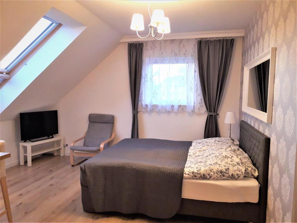 Televízia a/alebo spoločenská miestnosť v ubytovaní Pietrzak Apartments