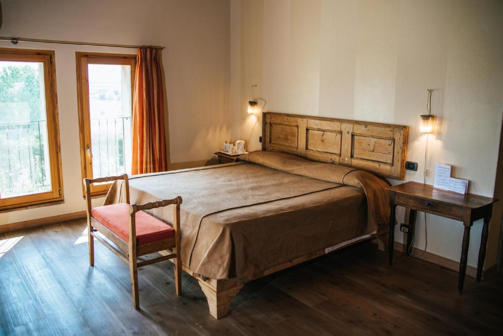 Postel nebo postele na pokoji v ubytování Cascina Girolda