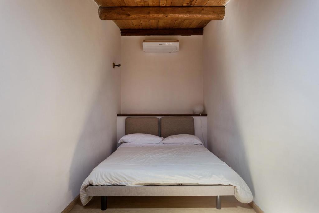 Łóżko lub łóżka w pokoju w obiekcie Alcalà Living Apartments