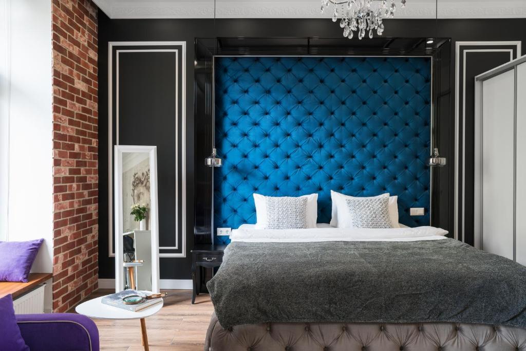 Postel nebo postele na pokoji v ubytování Theatre Boutique Apartments