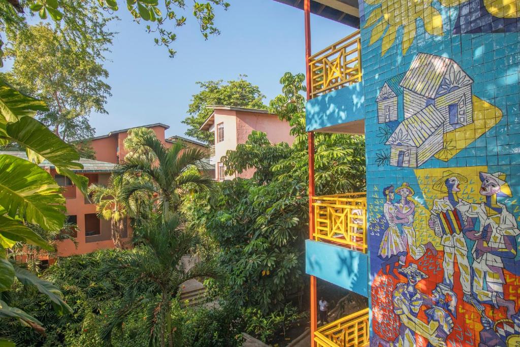 a mural on the side of a building at Hotel whala!boca chica - All Inclusive in Boca Chica