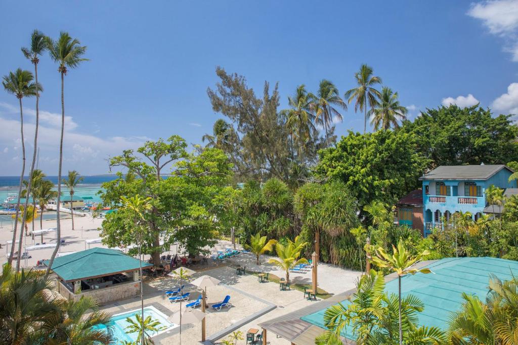 an aerial view of a resort with a pool and a beach at Hotel whala!boca chica - All Inclusive in Boca Chica