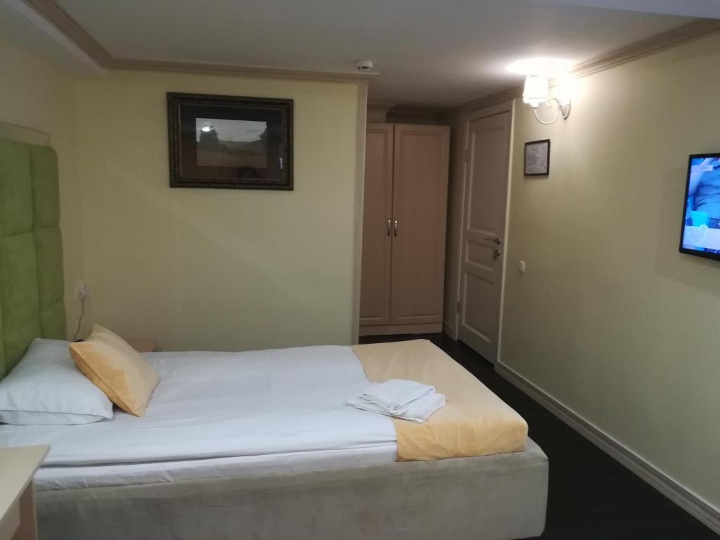 Postel nebo postele na pokoji v ubytování Jasmine Hotel