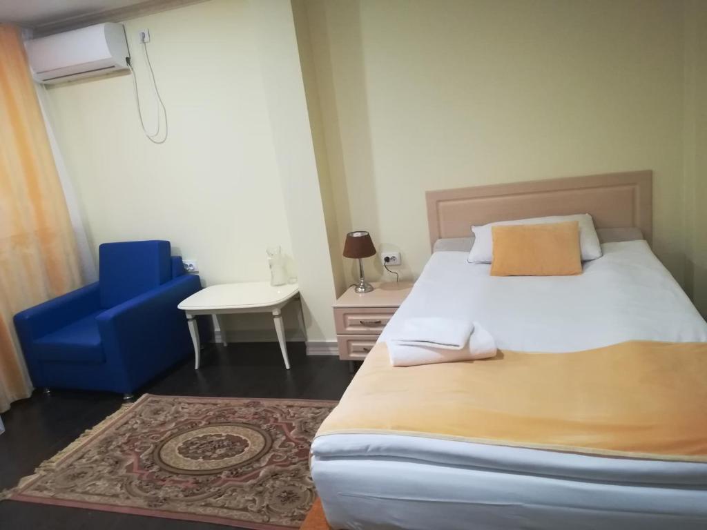 Postel nebo postele na pokoji v ubytování Jasmine Hotel