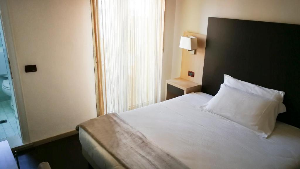 Postel nebo postele na pokoji v ubytování Park Hotel Serena