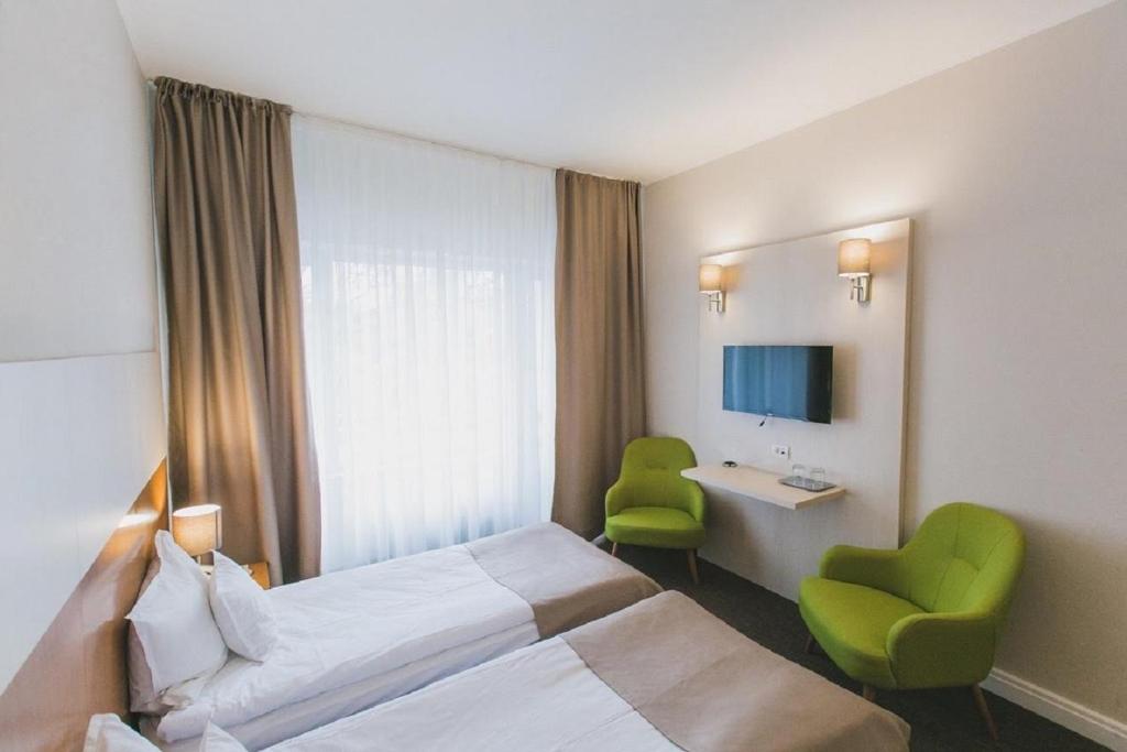 TV a/nebo společenská místnost v ubytování Hotel Nufarul