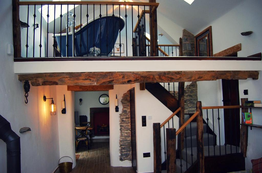a staircase in a house with a stair case at Rosie's Barn in Penrith
