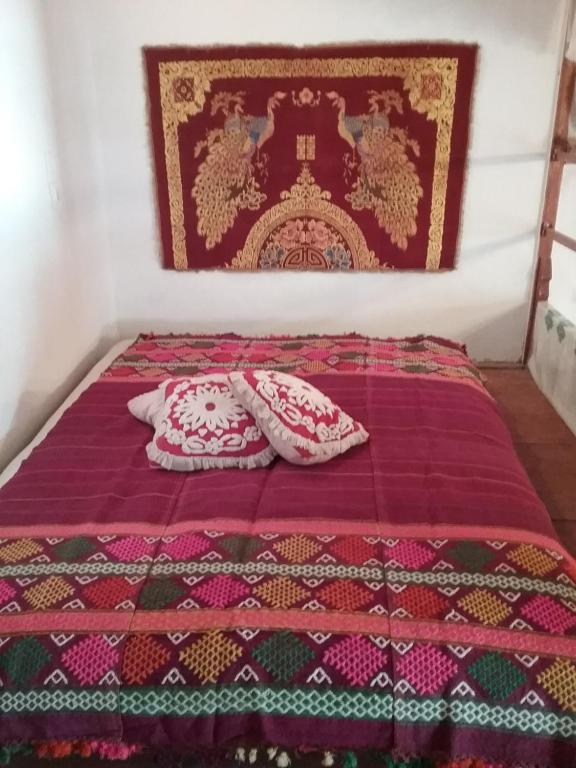 Postel nebo postele na pokoji v ubytování Karpathos house