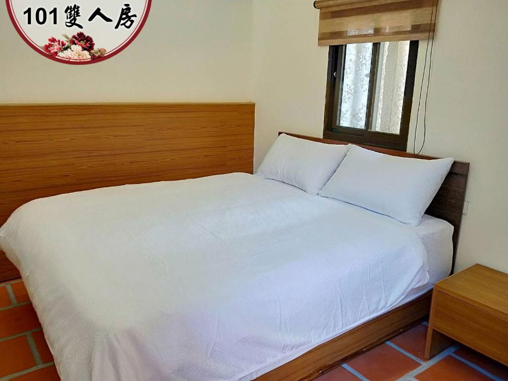 Postel nebo postele na pokoji v ubytování Kinmen Huquian 58