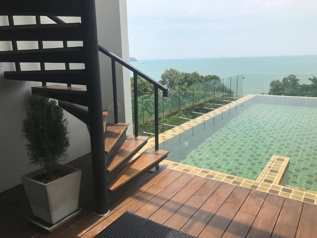 a house with a swimming pool on a deck at Deamber Bangsare Pattaya in Bang Sare