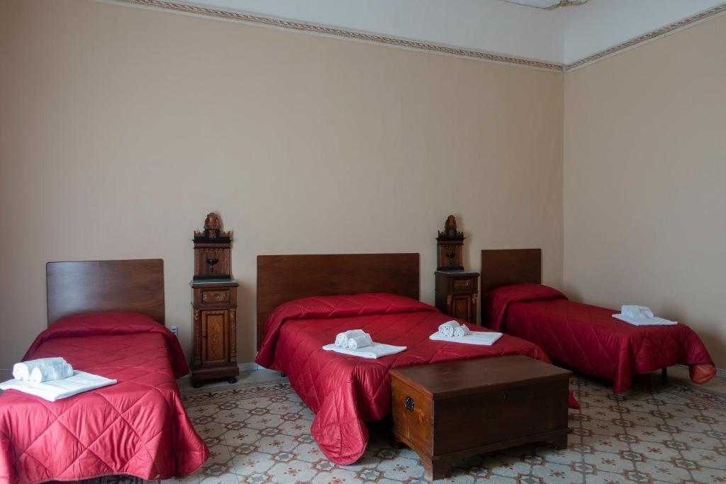 Postel nebo postele na pokoji v ubytování Alloggio della Posta Vecchia