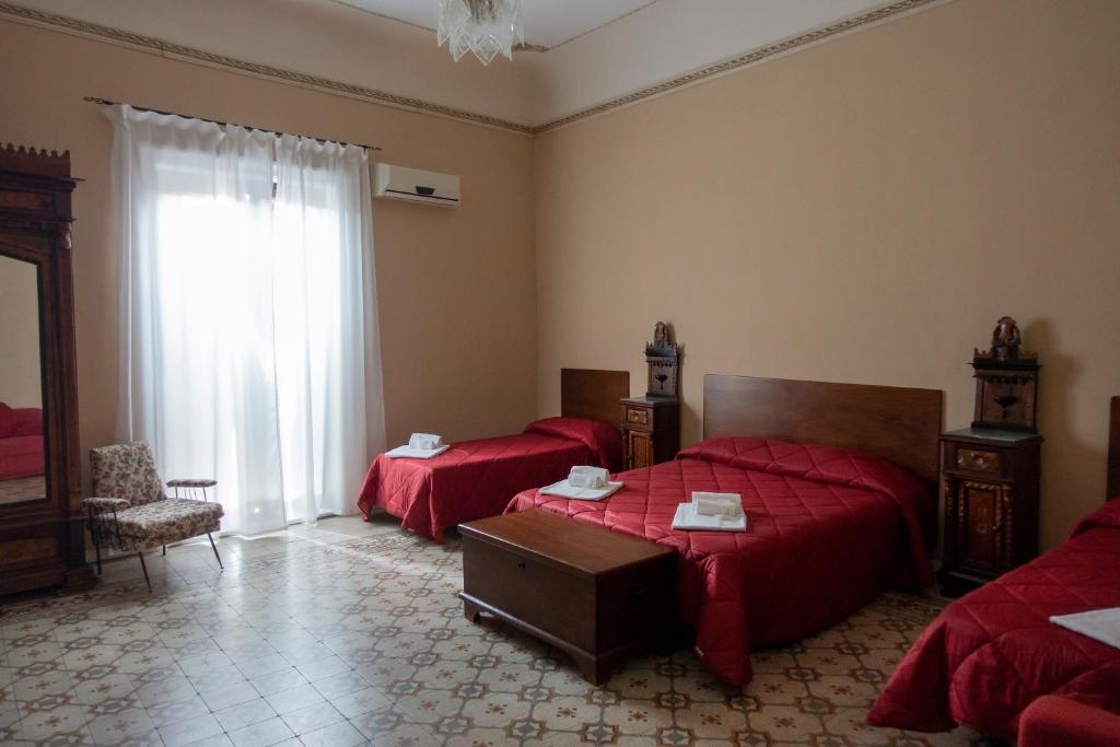 Postel nebo postele na pokoji v ubytování Alloggio della Posta Vecchia