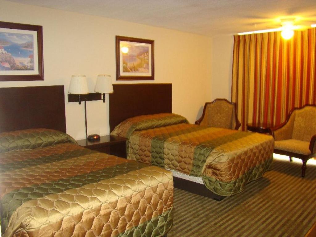 Postel nebo postele na pokoji v ubytování Romana Hotel - Houston Southwest