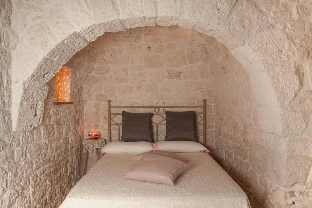 Postel nebo postele na pokoji v ubytování Trulli a Sud-Est