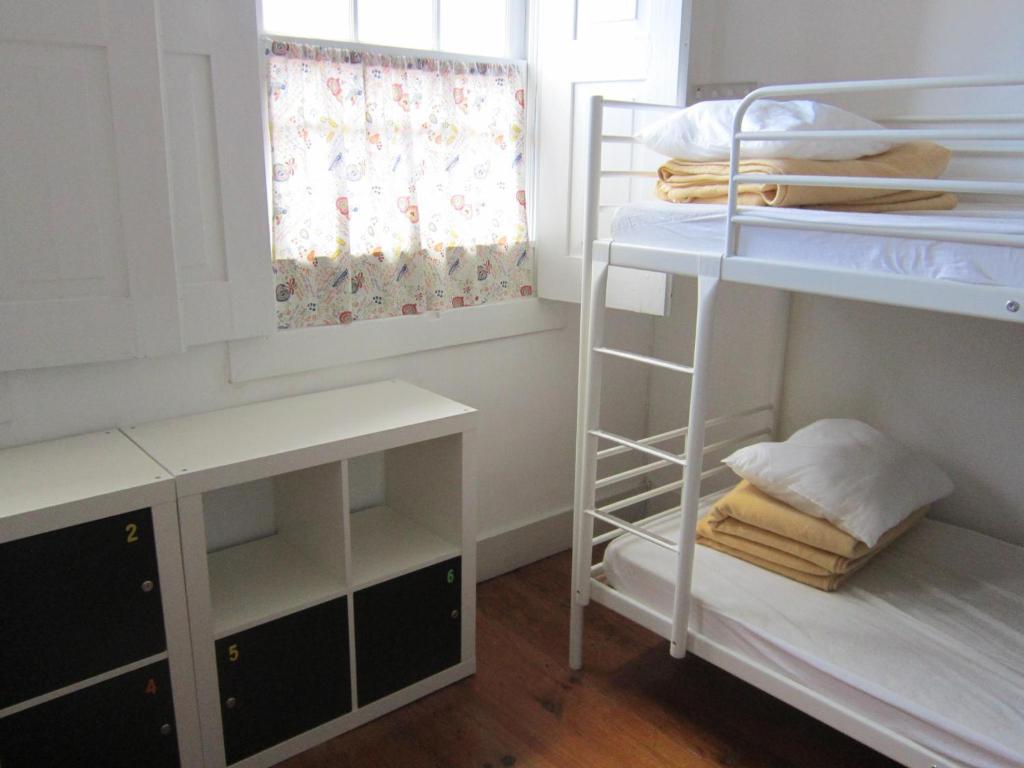 Postel nebo postele na pokoji v ubytování Hostel Prime Guimaraes