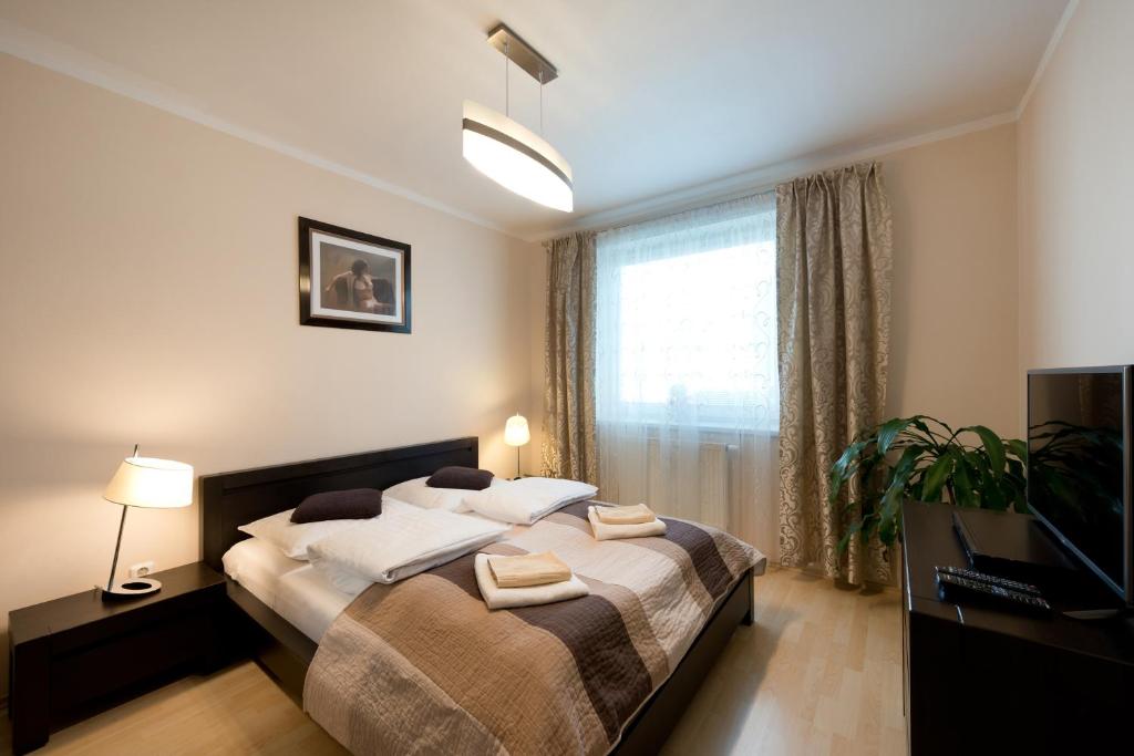 Postel nebo postele na pokoji v ubytování B2B Apartments