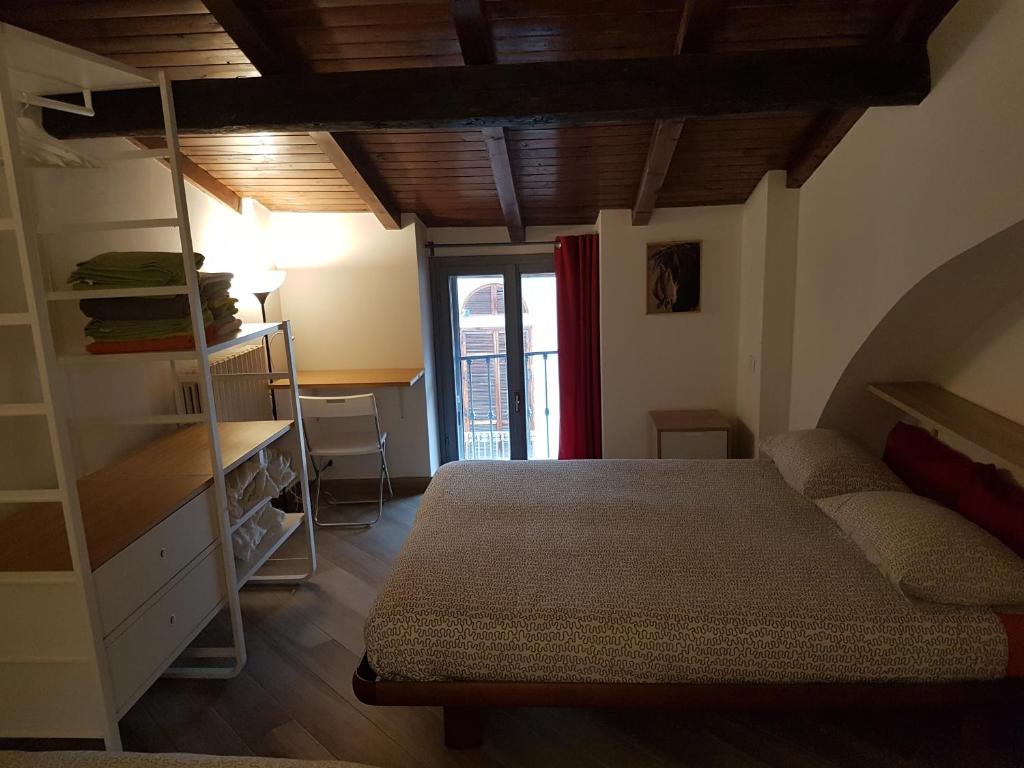 Postel nebo postele na pokoji v ubytování La Corte sul Naviglio