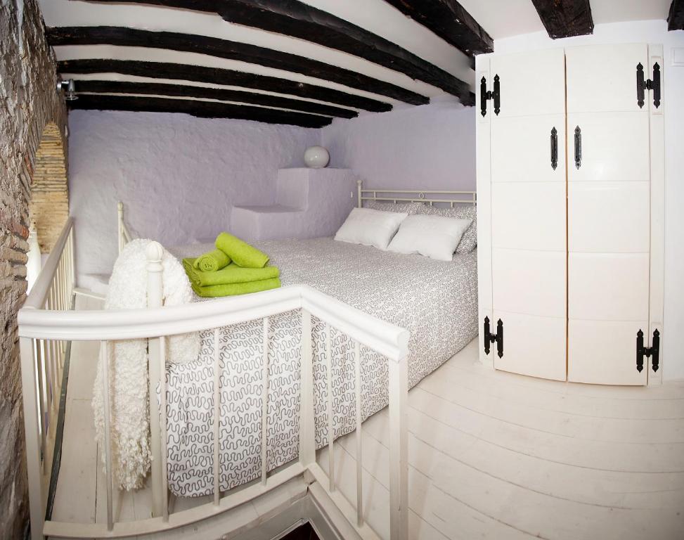 Posteľ alebo postele v izbe v ubytovaní Aurora Tiny Apartment
