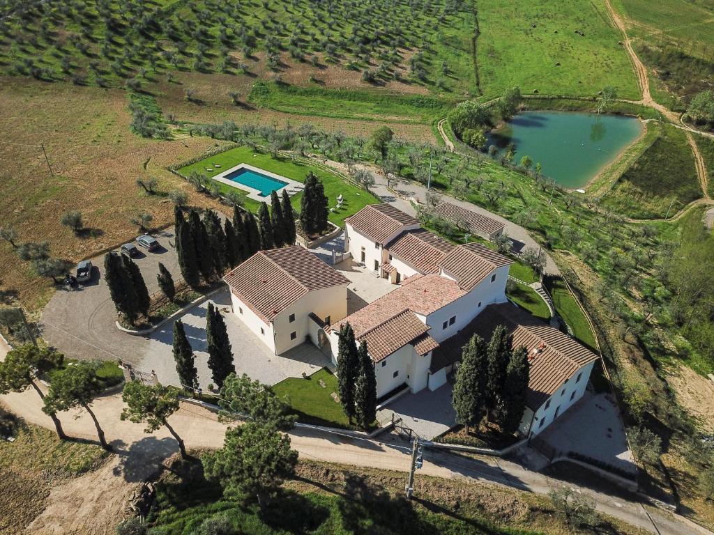 an overhead view of a large house with trees and a pool at Olmofiorito in Lastra a Signa