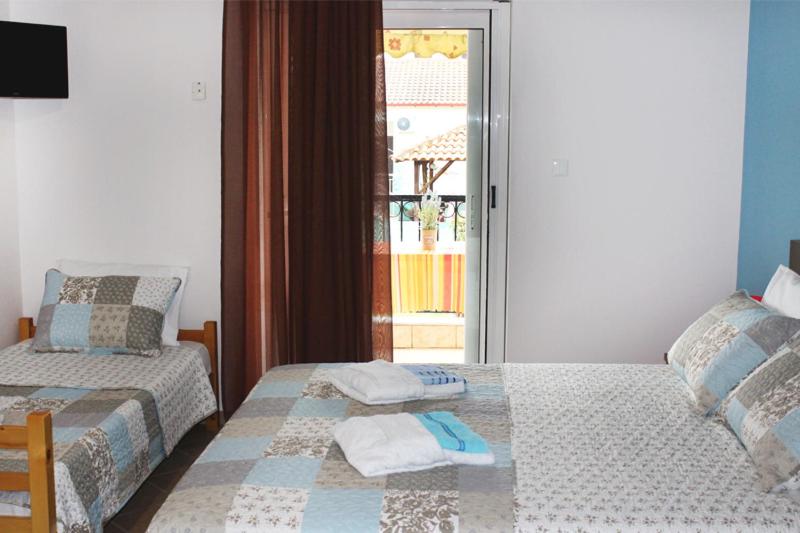 Posteľ alebo postele v izbe v ubytovaní Souzana Rooms