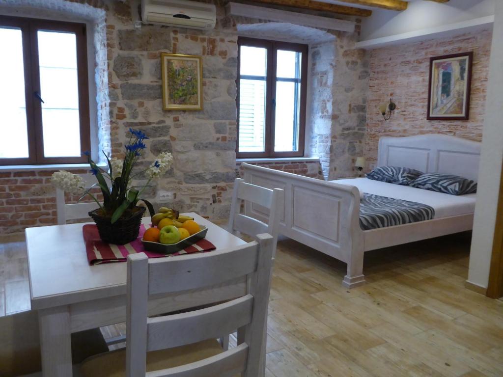 Postel nebo postele na pokoji v ubytování Apartments Đukić