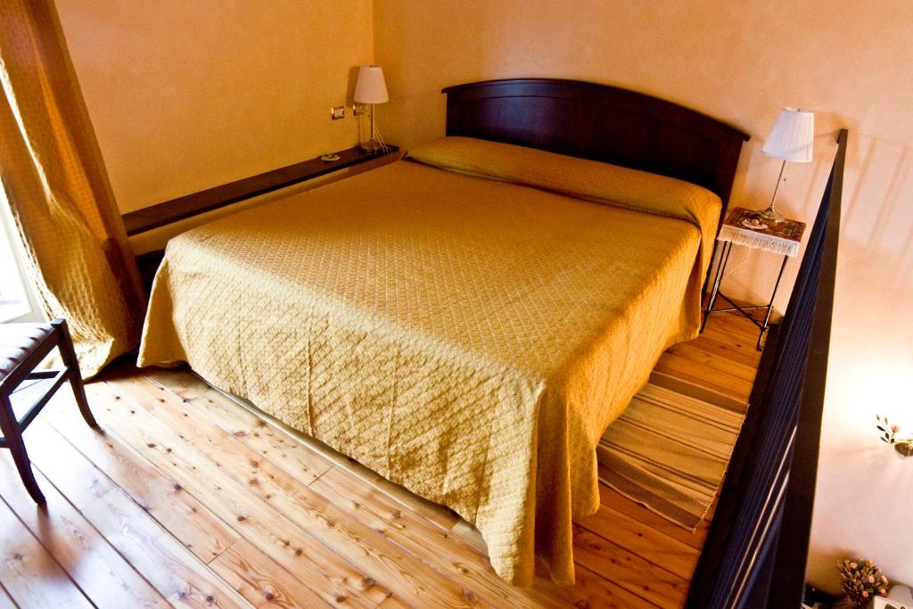 Postel nebo postele na pokoji v ubytování Locanda la Casetta