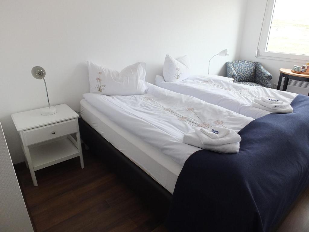 Postel nebo postele na pokoji v ubytování apartment Neðra-Vatnshorn