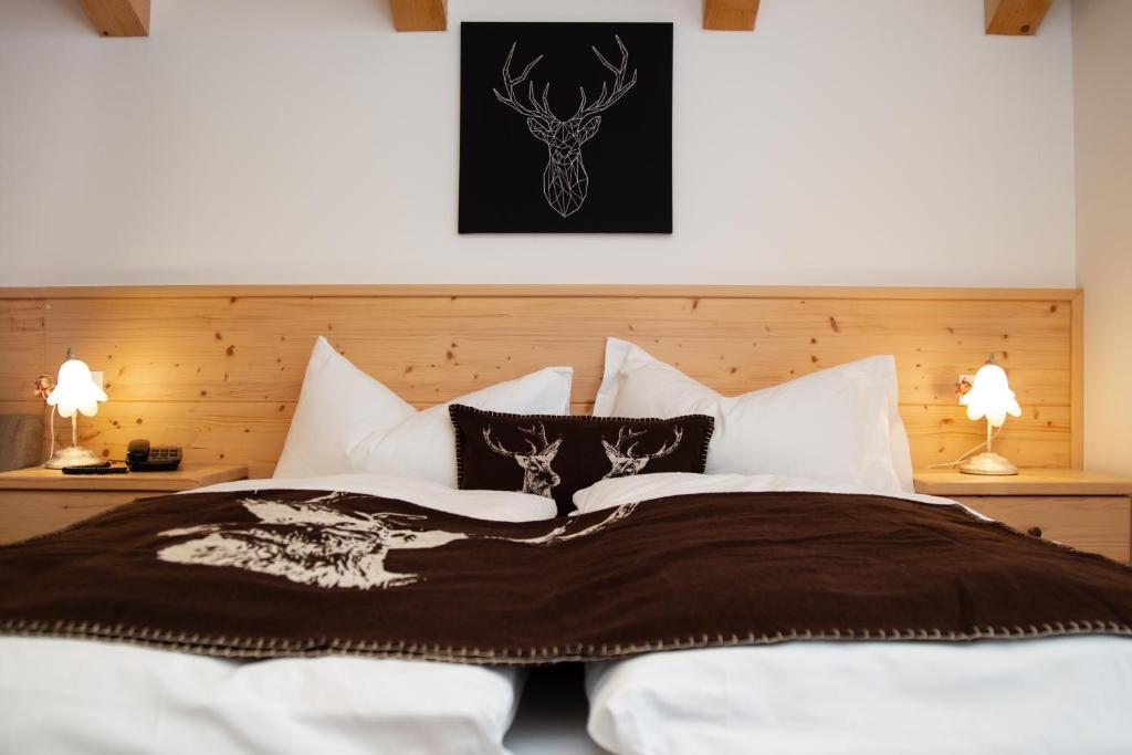 Postel nebo postele na pokoji v ubytování Hotel Chalet Giasenei
