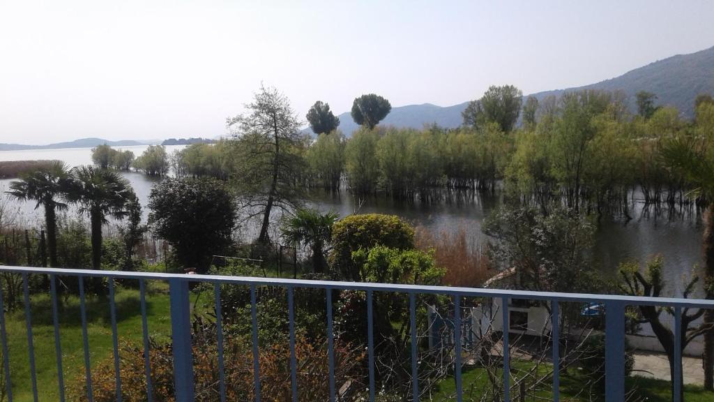 a view of a river from a balcony at Una finestra sul lago..Appartamento Verbania in Verbania